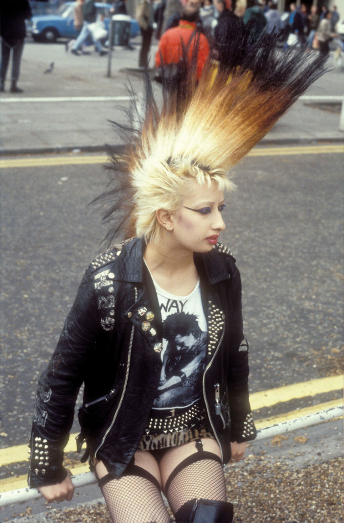 A punk girl with a large mohican, leather jacket and suspenders, UK ...